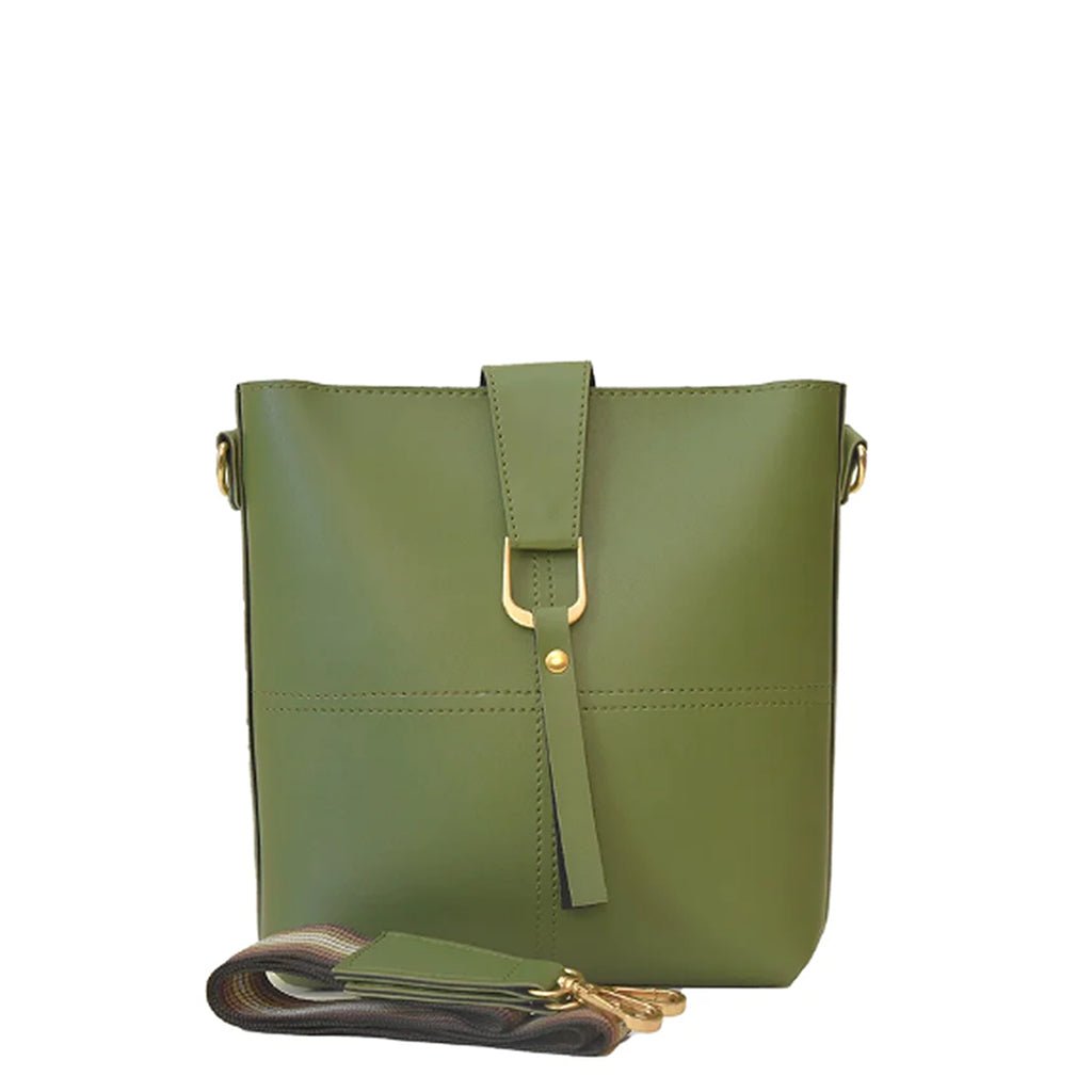 A green leather cross bag with a structured silhouette, gold-tone buckle, and an adjustable strap for versatile wear.