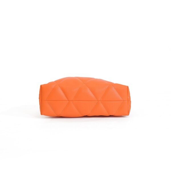 Vibrant orange quilted hand bag with secure closure