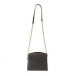Stylish black cross body bag with gold chain and luxurious suede front panel, ideal for a sophisticated look.