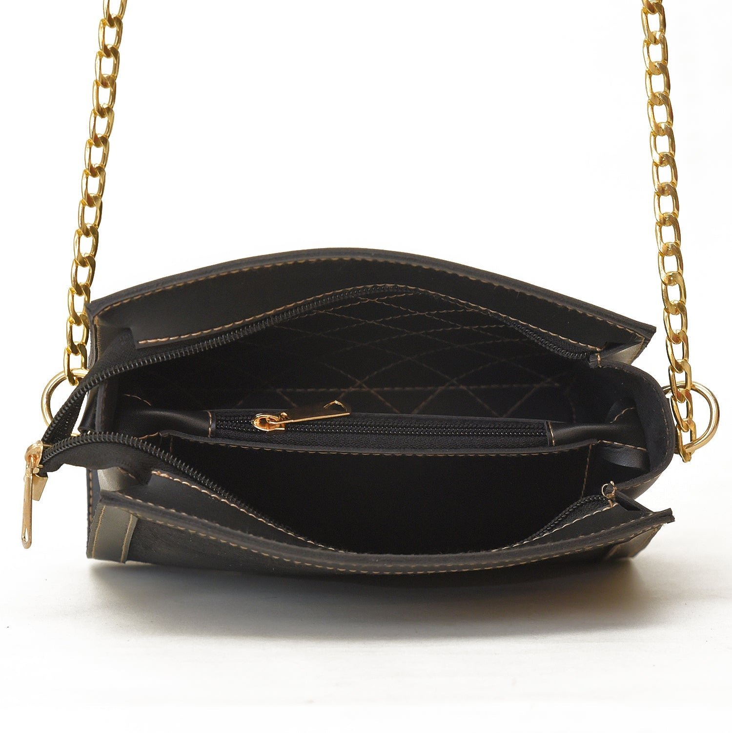 Stylish black cross body bag with gold chain and luxurious suede front panel, ideal for a sophisticated look.