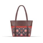 AJRAK ART Shoulder Bag featuring a traditional design and long leather straps, handcrafted in Pakistan.
