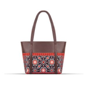 AJRAK ART Shoulder Bag featuring a traditional design and long leather straps, handcrafted in Pakistan.