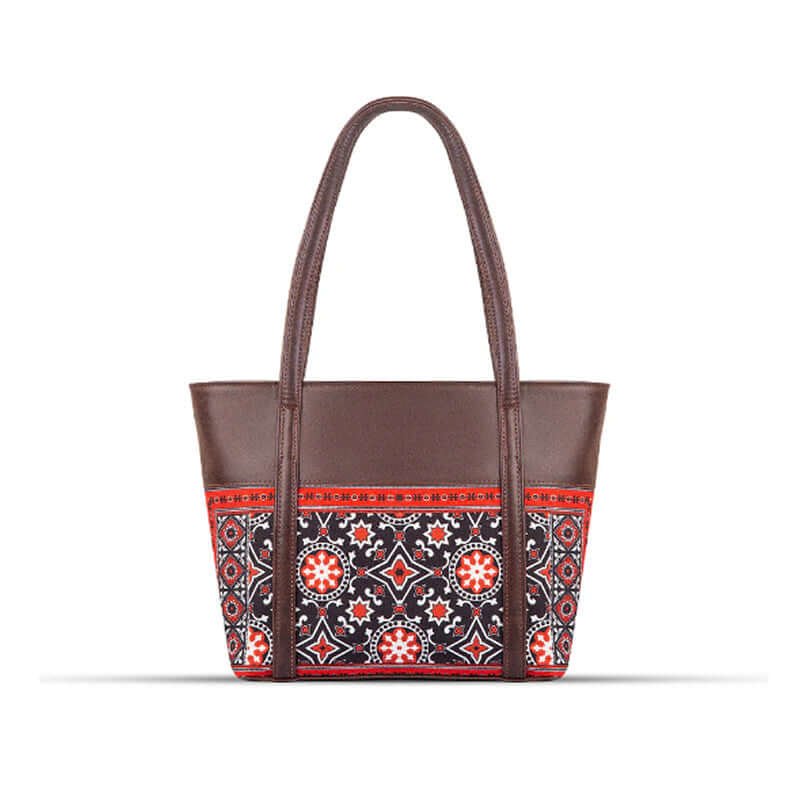 AJRAK ART Shoulder Bag featuring a traditional design and long leather straps, handcrafted in Pakistan.