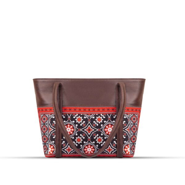 AJRAK ART Shoulder Bag featuring a traditional design and long leather straps, handcrafted in Pakistan.