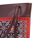 AJRAK ART Shoulder Bag featuring a traditional design and long leather straps, handcrafted in Pakistan.