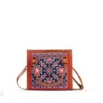 Discover the Ajrak Scarlet Handbag, featuring a traditional Sindhi heritage design. Shop premium handbags online in Pakistan today!