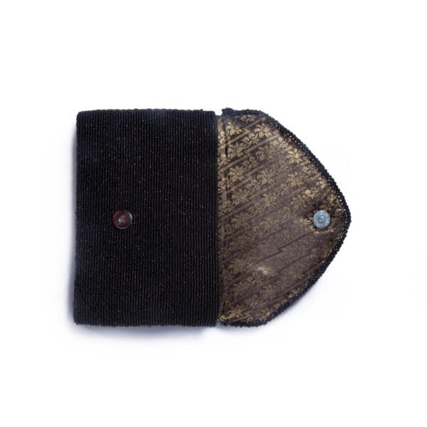 A stylish black beaded clutch purse with a shimmering, striped design on the flap, perfect for evening wear.