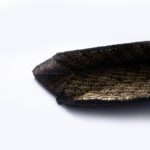 A stylish black beaded clutch purse with a shimmering, striped design on the flap, perfect for evening wear.