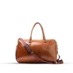 A BERLIN Duffel Bag with a large capacity, premium leather design, sturdy handles, and an adjustable strap for convenient travel in Pakistan.