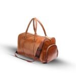 A BERLIN Duffel Bag with a large capacity, premium leather design, sturdy handles, and an adjustable strap for convenient travel in Pakistan.
