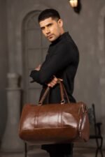 A BERLIN Duffel Bag with a large capacity, premium leather design, sturdy handles, and an adjustable strap for convenient travel in Pakistan.