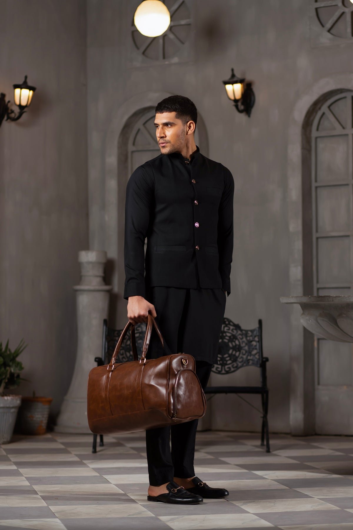 A BERLIN Duffel Bag with a large capacity, premium leather design, sturdy handles, and an adjustable strap for convenient travel in Pakistan.