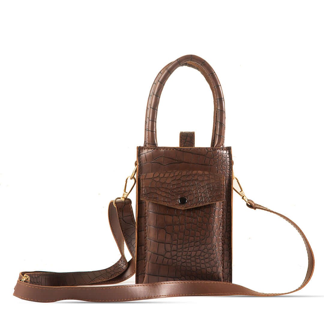 Bliss Phone Mini Pouch: Designed for convenienat mobile carrying during travel, crafted from premium leather with a long strap in a chic cocoa color. Available in Pakistan.