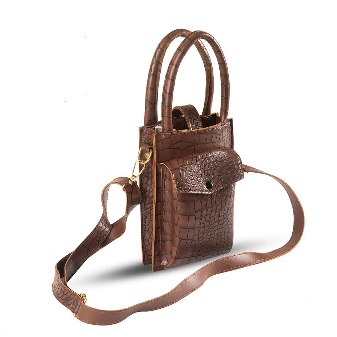 Bliss Phone Mini Pouch: Designed for convenienat mobile carrying during travel, crafted from premium leather with a long strap in a chic cocoa color. Available in Pakistan.