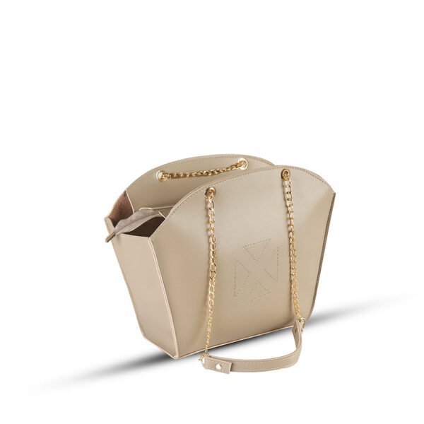 A stylish shoulder bag with a spacious Beige Color, adjustable strap, and sleek design in pakistan