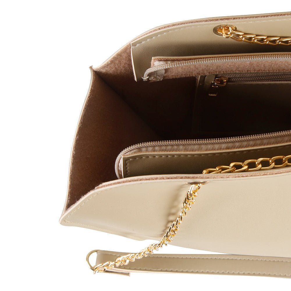 A stylish shoulder bag with a spacious Beige Color, adjustable strap, and sleek design in pakistan