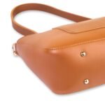 The Decide Shoulder Bags feature a versatile design in an elegant brown color, complete with an adjustable leather strap. Available in Pakistan.