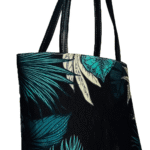 FOREST Shoulder Bag featuring a charming nature-inspired design, complemented by a durable leather strap for easy carrying. now available in Pakistan.