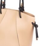 The Kate Tote Bags feature an elegant design, available with a sleek black leather strap or in a sophisticated beige color, now in Pakistan.