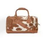 Moxi brown leather bag, featuring a cow-inspired design, now available in Pakistan.