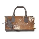 Moxi brown leather bag, featuring a cow-inspired design, now available in Pakistan.