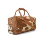 Moxi brown leather bag, featuring a cow-inspired design, now available in Pakistan.