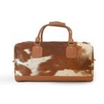 Moxi brown leather bag, featuring a cow-inspired design, now available in Pakistan.