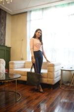 The Nova Tote Bags, available in elegant Green, come with two wallet pieces and are now offered in Pakistan.