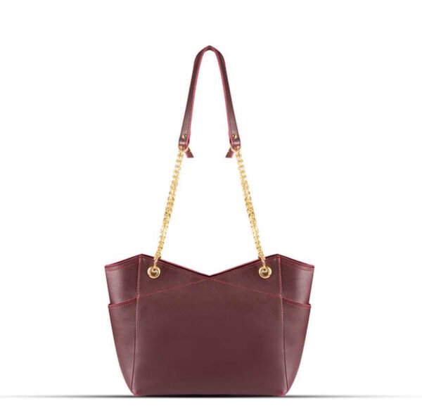 Stylish Tote bag with a gold chain accent and a maroon strap, available in an elegant maroon color. Now available in Pakistan.