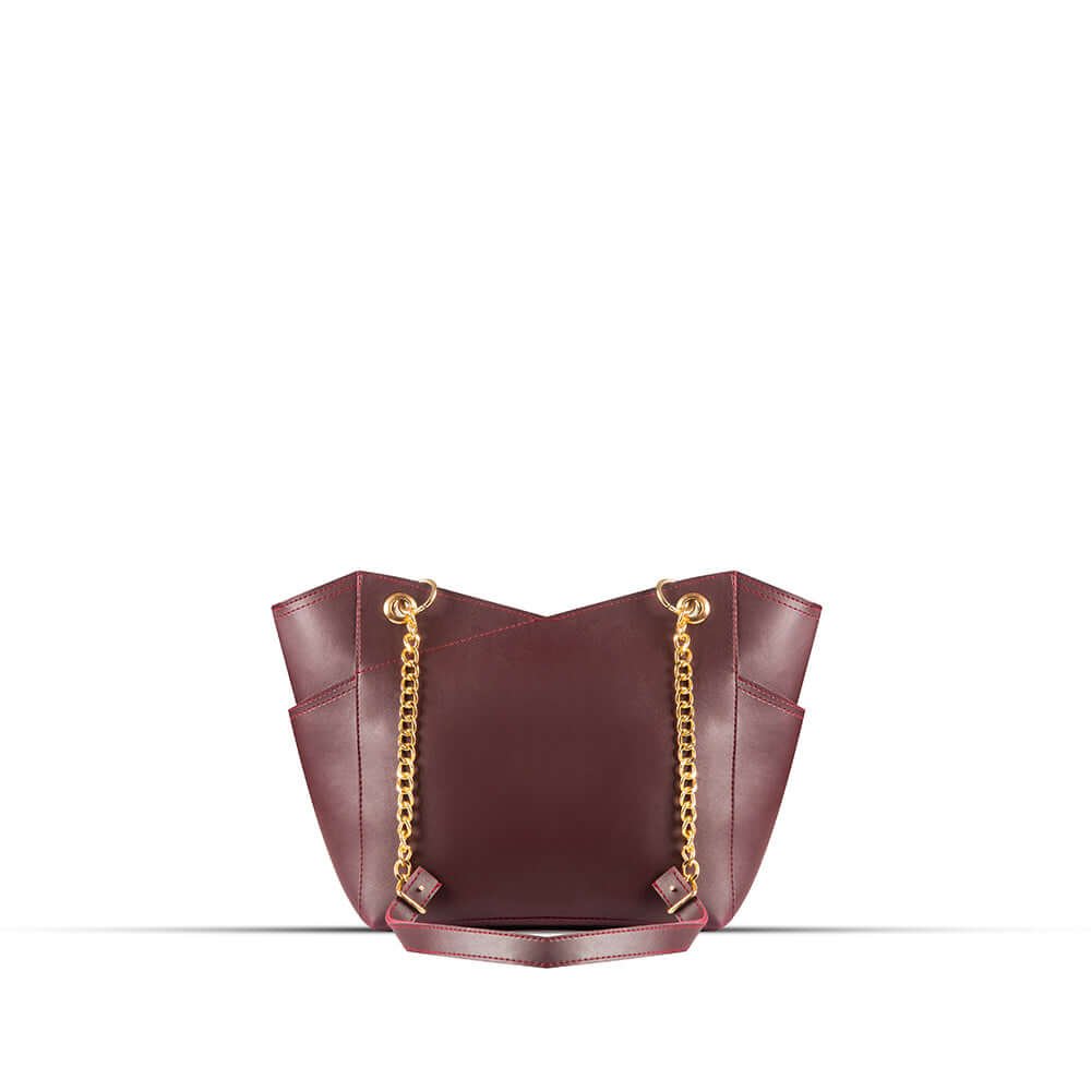 Stylish Tote bag with a gold chain accent and a maroon strap, available in an elegant maroon color. Now available in Pakistan.