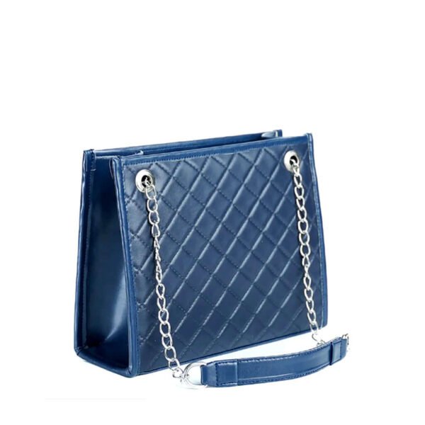 The Sydney Shoulder Bag, designed with premium synthetic leather and a silver-tone metal chain strap, is available in an elegant blue color in Pakistan.