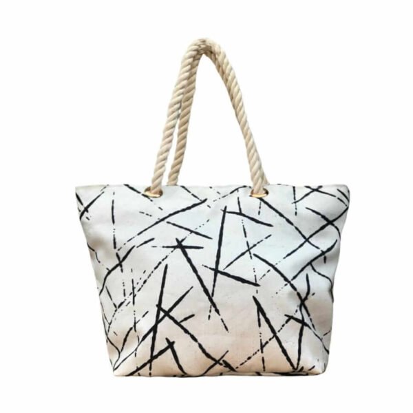 The stylish TETRA CANVAS TOTE bag features durable rope handles and a sleek canvas design on a white base. Now available in Pakistan.