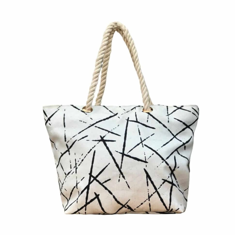 The stylish TETRA CANVAS TOTE bag features durable rope handles and a sleek canvas design on a white base. Now available in Pakistan.