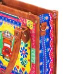 Celebrate Pakistan's vibrant culture with our Truck Art Handbag – a perfect blend of tradition and vibrant colors. Featuring a bold, colorful design paired with a contrasting brown leather handle, it’s a unique accessory that stands out beautifully.