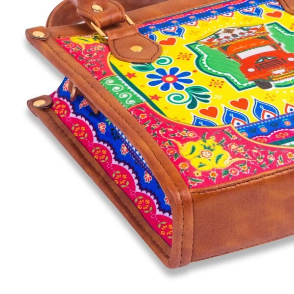 Celebrate Pakistan's vibrant culture with our Truck Art Handbag – a perfect blend of tradition and vibrant colors. Featuring a bold, colorful design paired with a contrasting brown leather handle, it’s a unique accessory that stands out beautifully.