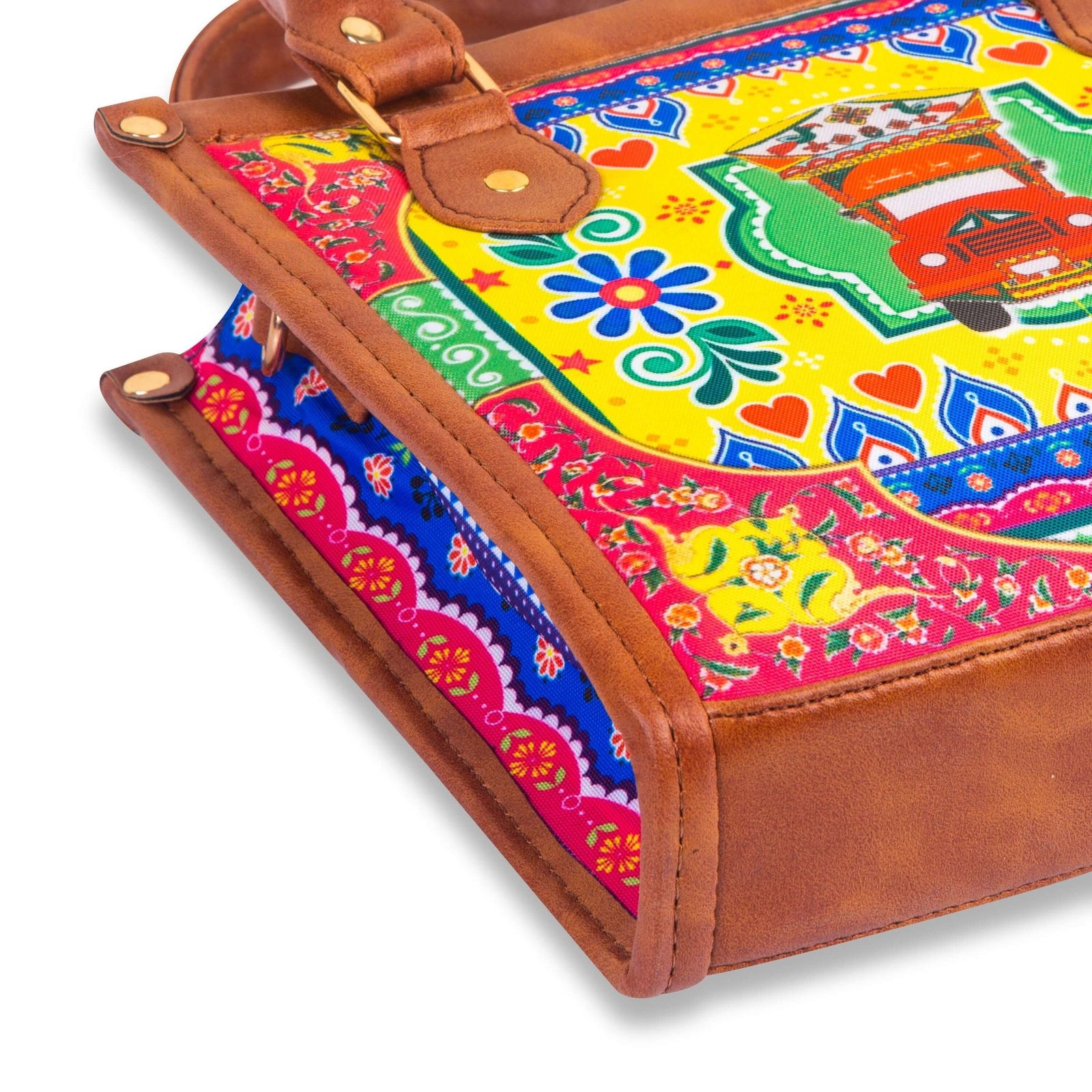 Celebrate Pakistan's vibrant culture with our Truck Art Handbag – a perfect blend of tradition and vibrant colors. Featuring a bold, colorful design paired with a contrasting brown leather handle, it’s a unique accessory that stands out beautifully.