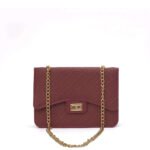 This stylish Tulip chain bag, crafted from high-quality faux leather in an elegant maroon color, features an adjustable chain strap and is available in Pakistan.