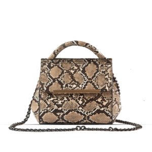 VENOM Shoulder bag premium snake skin material With Charming silver Chain crafted in an elegant brown and beige color combination. Now available in Pakistan.