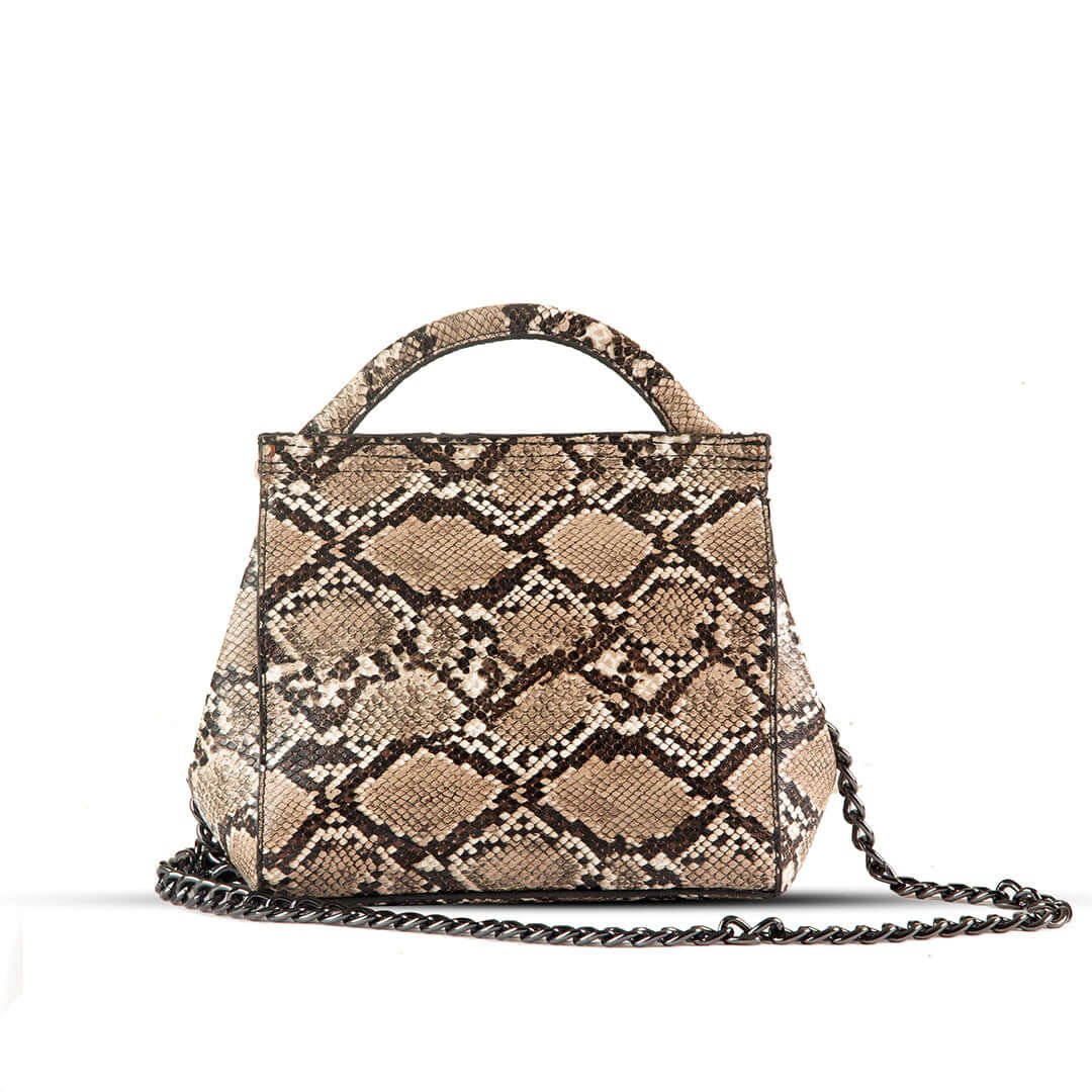 VENOM Shoulder bag premium snake skin material With Charming silver Chain crafted in an elegant brown and beige color combination. Now available in Pakistan.