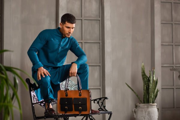 Brown and black VINTAGE LAPTOP BAG with buckle pockets, sturdy handles, and an adjustable strap for professionals in Pakistan.