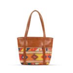 Vivid brown shoulder bag featuring a handcrafted design and a durable leather strap, now available in Pakistan.