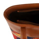 Vivid brown shoulder bag featuring a handcrafted design and a durable leather strap, now available in Pakistan.