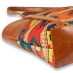Vivid brown shoulder bag featuring a handcrafted design and a durable leather strap, now available in Pakistan.