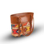 Vivid brown shoulder bag featuring a handcrafted design and a durable leather strap, now available in Pakistan.